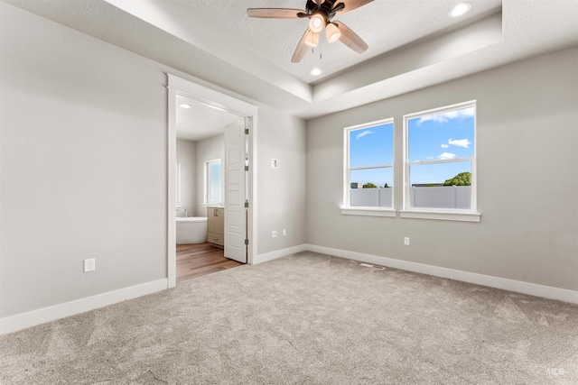 4469 E Wingate Ct, Nampa, ID 83687 - carpeted empty room with a ceiling fan, baseboards, recessed lighting, and a raised ceiling