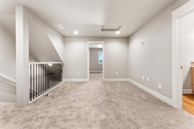 4469 E Wingate Ct, Nampa, ID 83687 - spare room with attic access, carpet flooring, baseboards, and recessed lighting