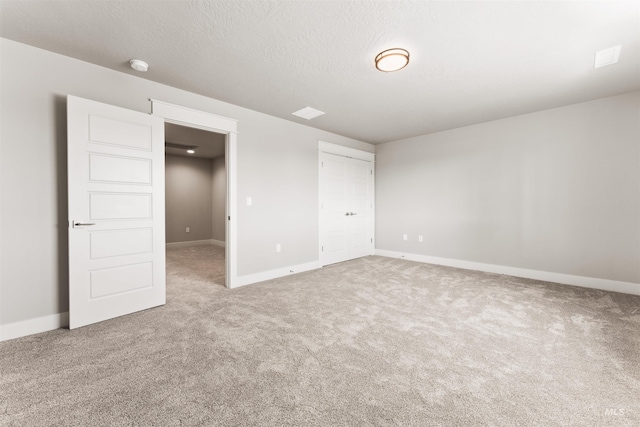 4469 E Wingate Ct, Nampa, ID 83687 - unfurnished bedroom with carpet floors, baseboards, a closet, and a textured ceiling