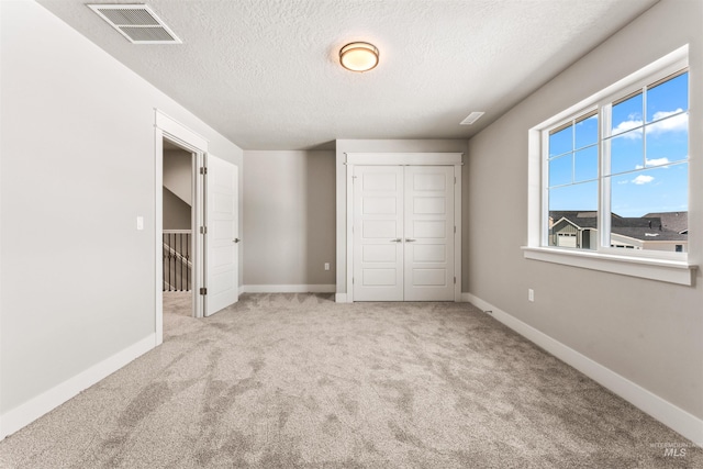 4469 E Wingate Ct, Nampa, ID 83687 - unfurnished bedroom with carpet, a textured ceiling, a closet, and baseboards