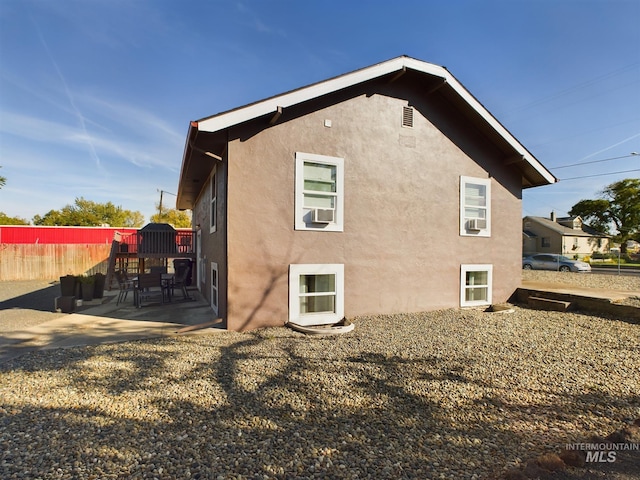 rear view of house with a patio