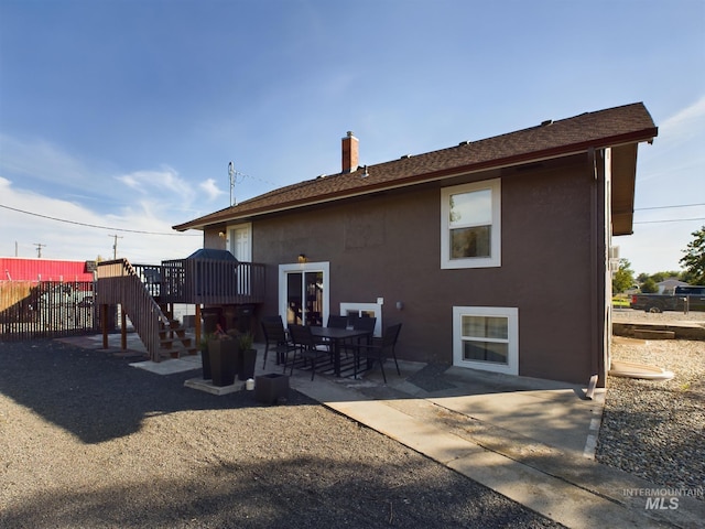 rear view of house with a patio