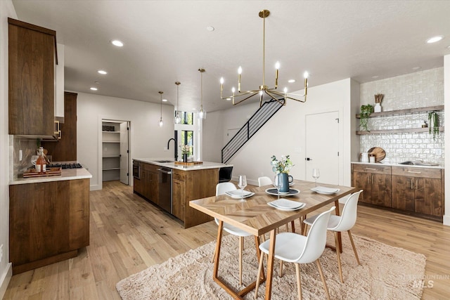 1796 S Eagleson Rd, Boise, ID 83705 - dining room with light wood-style flooring, recessed lighting, and a chandelier