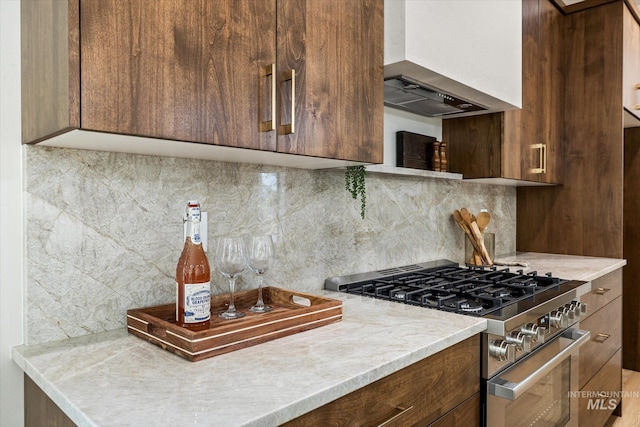 1796 S Eagleson Rd, Boise, ID 83705 - kitchen featuring high end range, wall chimney exhaust hood, and light countertops