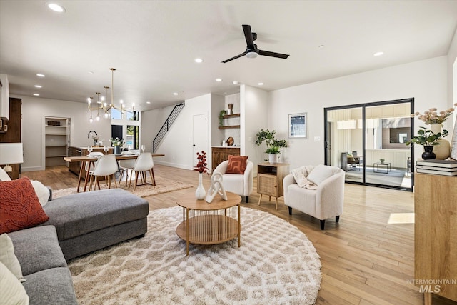 1796 S Eagleson Rd, Boise, ID 83705 - living area featuring a chandelier, recessed lighting, ceiling fan, light wood-type flooring, and baseboards