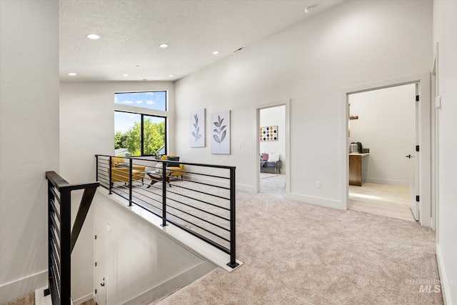 1796 S Eagleson Rd, Boise, ID 83705 - corridor with an upstairs landing, carpet floors, recessed lighting, a high ceiling, and baseboards