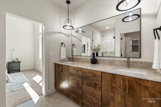 1796 S Eagleson Rd, Boise, ID 83705 - bathroom featuring double vanity, tile patterned flooring, an enclosed shower, and baseboards