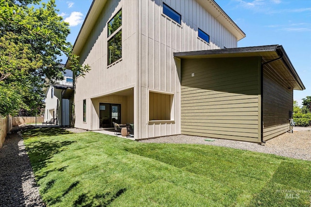 1796 S Eagleson Rd, Boise, ID 83705 - rear view of house with board and batten siding and a patio