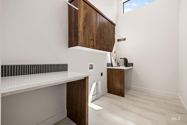1796 S Eagleson Rd, Boise, ID 83705 - laundry area featuring hookup for an electric dryer, cabinet space, light wood-style flooring, hookup for a washing machine, and baseboards