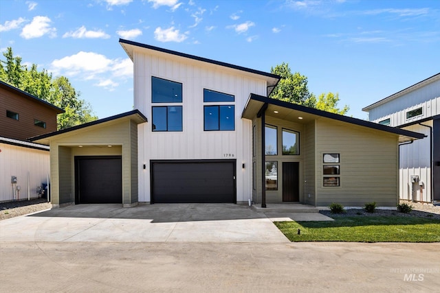 1796 S Eagleson Rd, Boise, ID 83705 - contemporary house featuring concrete driveway and a garage