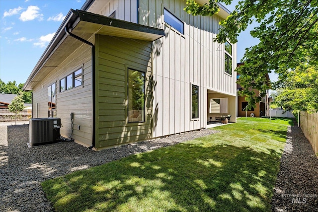 1796 S Eagleson Rd, Boise, ID 83705 - view of property exterior with cooling unit, board and batten siding, and a patio