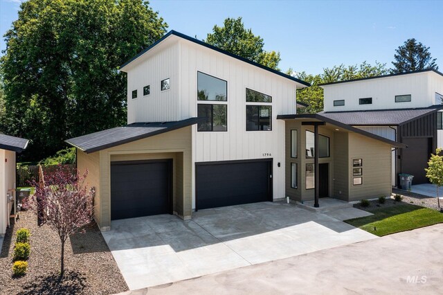 1796 S Eagleson Rd, Boise, ID 83705 - modern home with concrete driveway and a garage