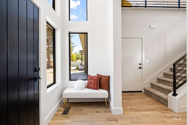 1796 S Eagleson Rd, Boise, ID 83705 - entrance foyer featuring plenty of natural light, light wood-style floors, stairway, a towering ceiling, and baseboards