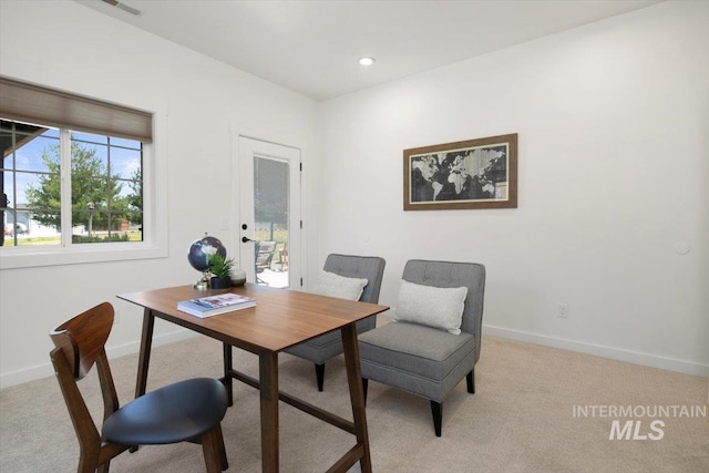 office space featuring recessed lighting, light colored carpet, and baseboards