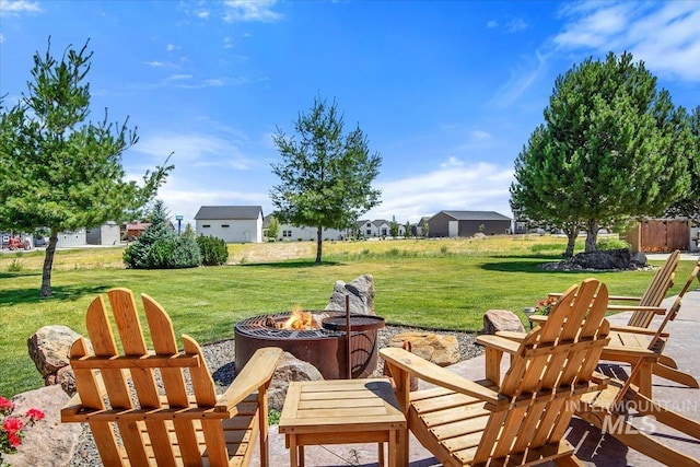 view of patio / terrace featuring an outdoor fire pit