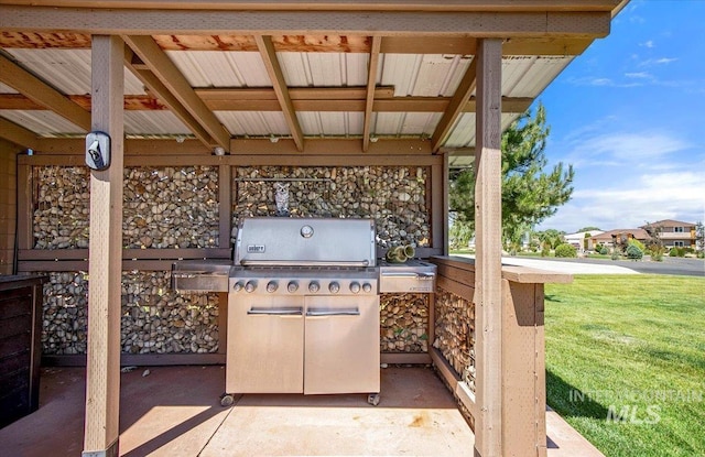 view of patio with exterior kitchen and grilling area