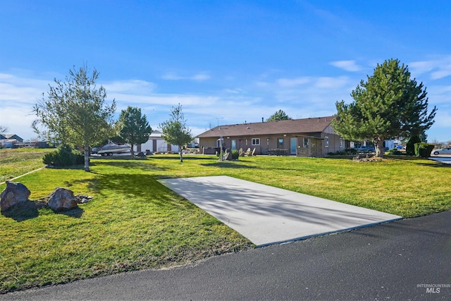 ranch-style home featuring a front yard