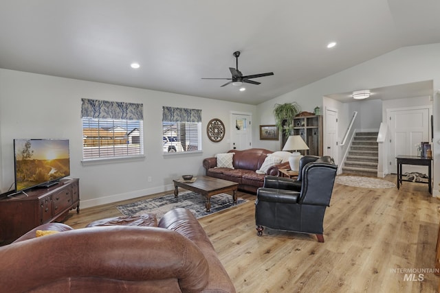 1317 Kyla Ct, Jerome, ID 83338 - living area featuring lofted ceiling, stairway, light wood-style floors, ceiling fan, and baseboards