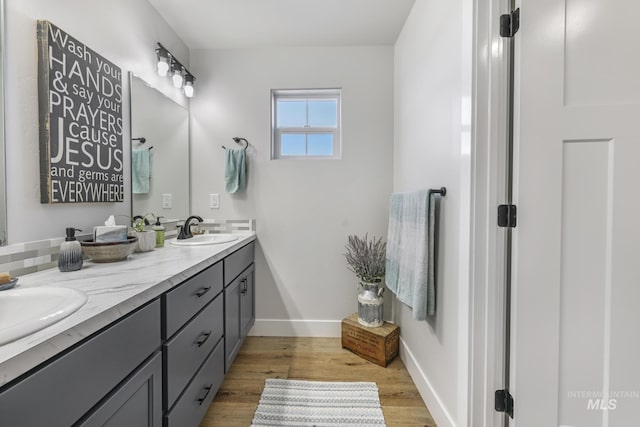1317 Kyla Ct, Jerome, ID 83338 - full bath featuring wood finished floors, double vanity, and baseboards