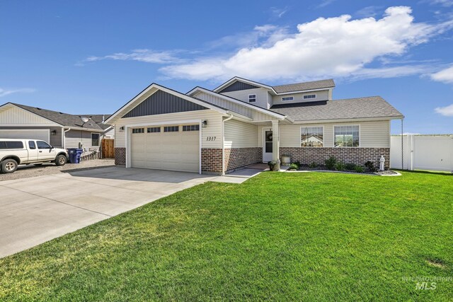 1317 Kyla Ct, Jerome, ID 83338 - craftsman house with brick siding, a garage, board and batten siding, and concrete driveway