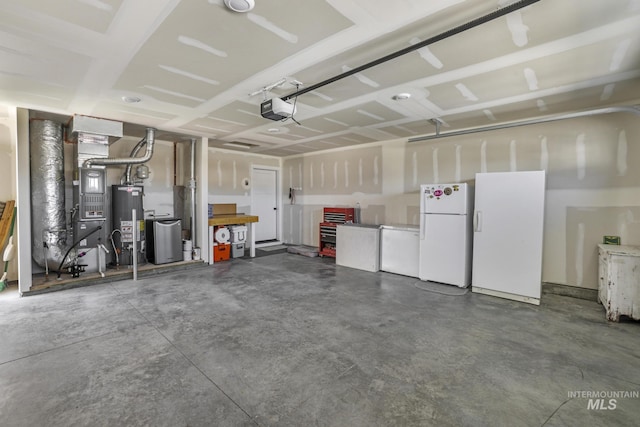 1317 Kyla Ct, Jerome, ID 83338 - garage featuring freestanding refrigerator, fridge, a garage door opener, and water heater