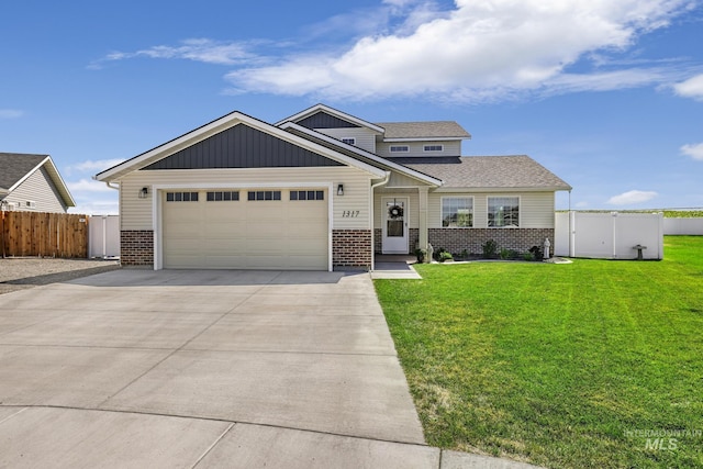 1317 Kyla Ct, Jerome, ID 83338 - view of front of property with brick siding, an attached garage, concrete driveway, and a shingled roof