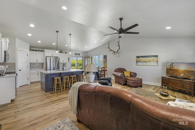 1317 Kyla Ct, Jerome, ID 83338 - living room with light wood-type flooring, a ceiling fan, recessed lighting, and vaulted ceiling