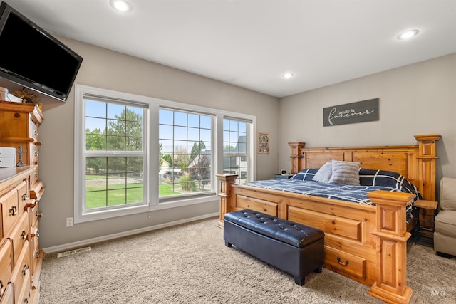 carpeted bedroom with baseboards, visible vents, and recessed lighting