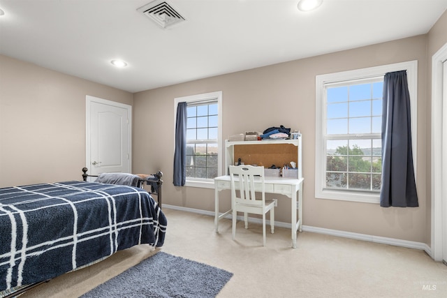 bedroom with light colored carpet, visible vents, baseboards, and recessed lighting