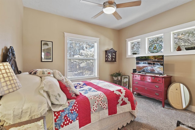 carpeted bedroom featuring a ceiling fan