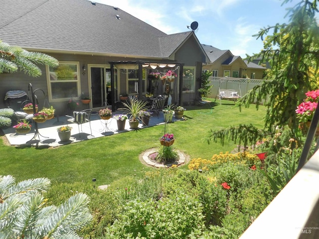 view of yard featuring a patio area and fence