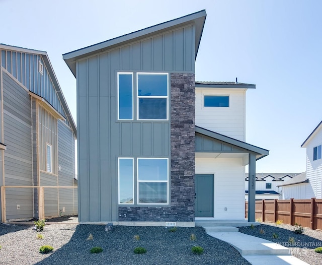 2860 E Boulder Basin Dr, Kuna, ID 83634 - contemporary home featuring fence, stone siding, and board and batten siding