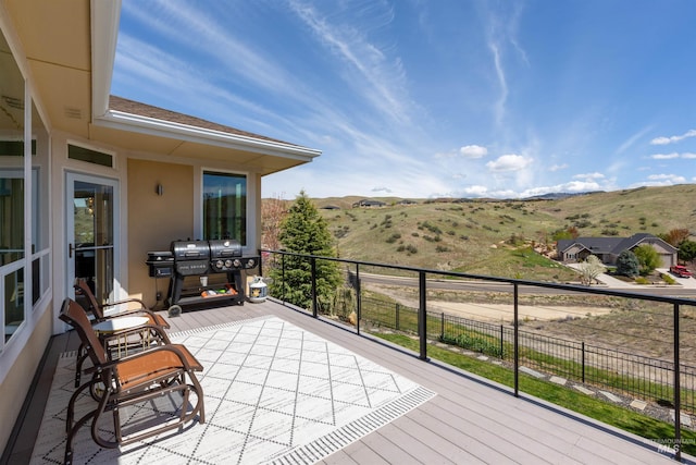 wooden terrace with a mountain view