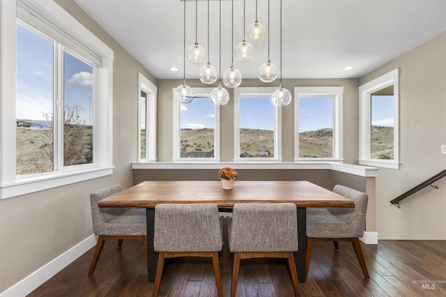 dining room with recessed lighting, baseboards, breakfast area, and hardwood / wood-style flooring