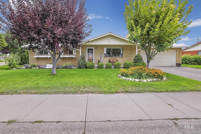 view of front of property featuring a garage and a front yard