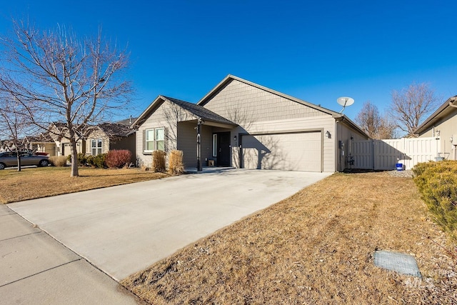 ranch-style home with a garage and a front yard