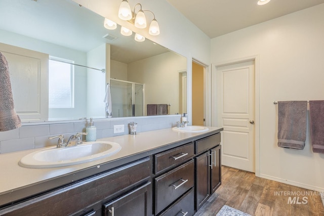 bathroom with vanity, hardwood / wood-style floors, and walk in shower