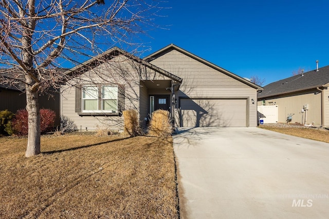 view of front of property with a garage and a front yard