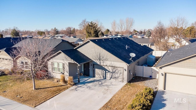 view of front of house with a garage and a front lawn