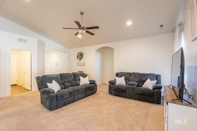 carpeted living room featuring vaulted ceiling and ceiling fan