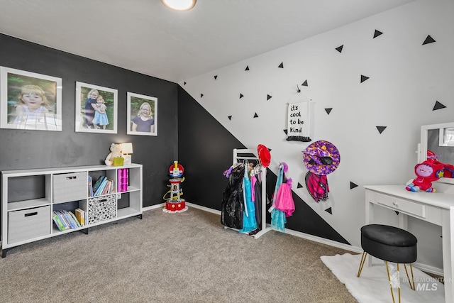 playroom featuring lofted ceiling and carpet