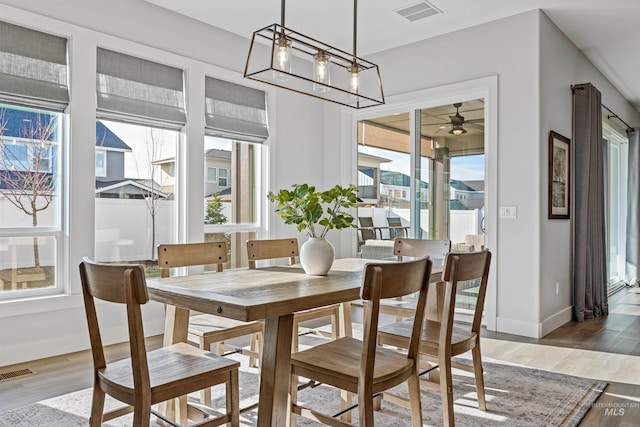 dining area with wood-type flooring