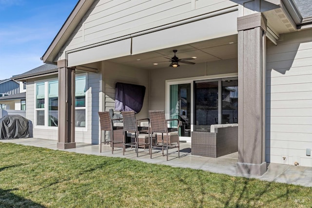 exterior space featuring a grill and ceiling fan