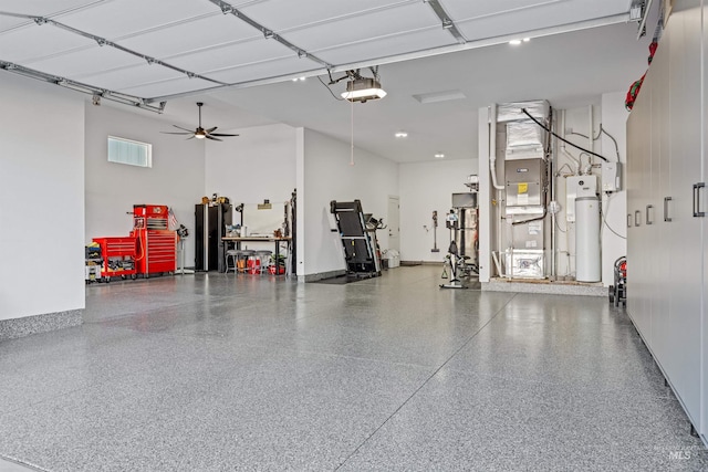 garage featuring water heater and a garage door opener