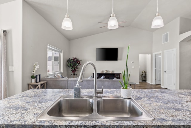 847 Bridget St, Twin Falls, ID 83301 - kitchen featuring a sink, open floor plan, ceiling fan, hanging light fixtures, and high vaulted ceiling