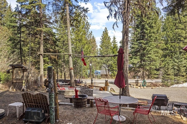 view of playground featuring a patio