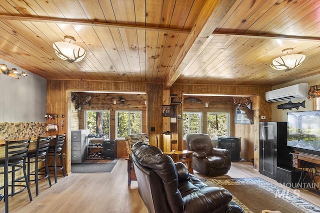 living room featuring wood walls, wooden ceiling, wood finished floors, and a wall mounted AC