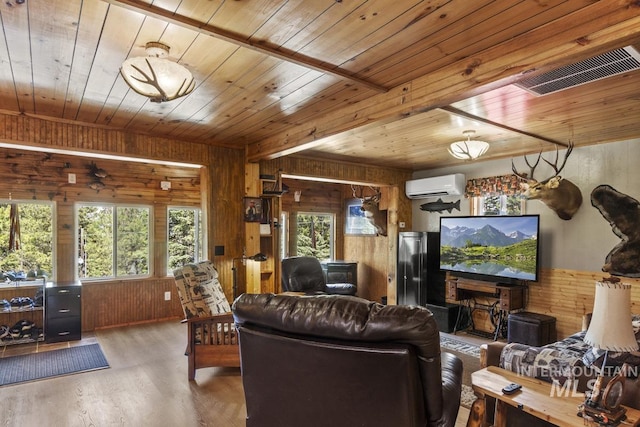 living room featuring wooden walls, a wall unit AC, and wooden ceiling