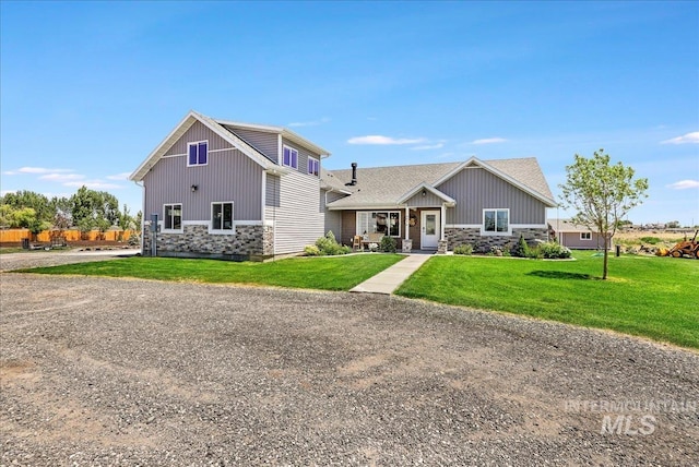 4076 N 3446 E, Kimberly, ID 83341 - craftsman inspired home featuring stone siding, a front lawn, and board and batten siding