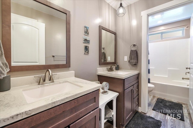 4076 N 3446 E, Kimberly, ID 83341 - full bathroom featuring two vanities, shower / bathtub combination, and wood finished floors